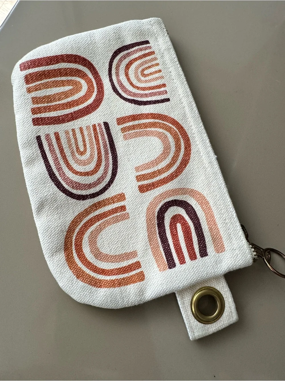 Danica Studio canvas zip pouch with terracotta rainbow screen-print design
